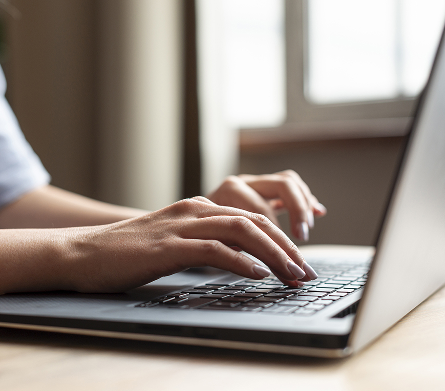 Woman working on a laptop - Digital Services